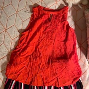 Red sleeveless top